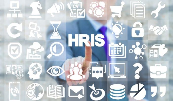 An HR professional touches an icon that says HRIS.